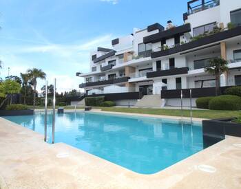 Люкс-квартира с общим бассейном и видом на море в Ориуэле 3