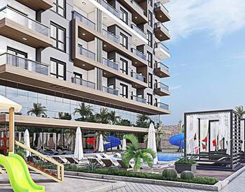 Новые Квартиры в Алании в Проекте с Бассейнами и Аквапарком 1