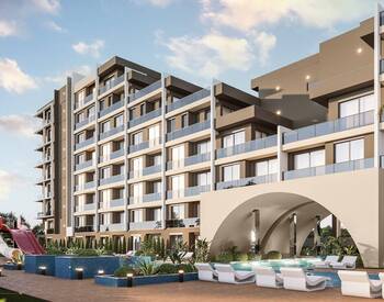 Antalya Altıntaş'ta Aquaparklı ve Havuzlu Sitede 1+1 Daireler 3