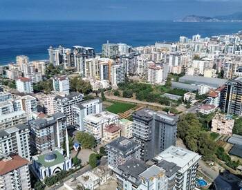 Квартира с выходом к бассейну в Махмутларе, Алания 1