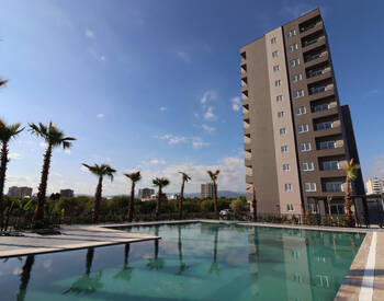 Apartments with a Pool in a Prime Location in Mersin Çeşmeli 1