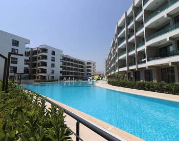 Real Estate in a Complex with a Pool Near the Sea in Tömük, Mersin 1