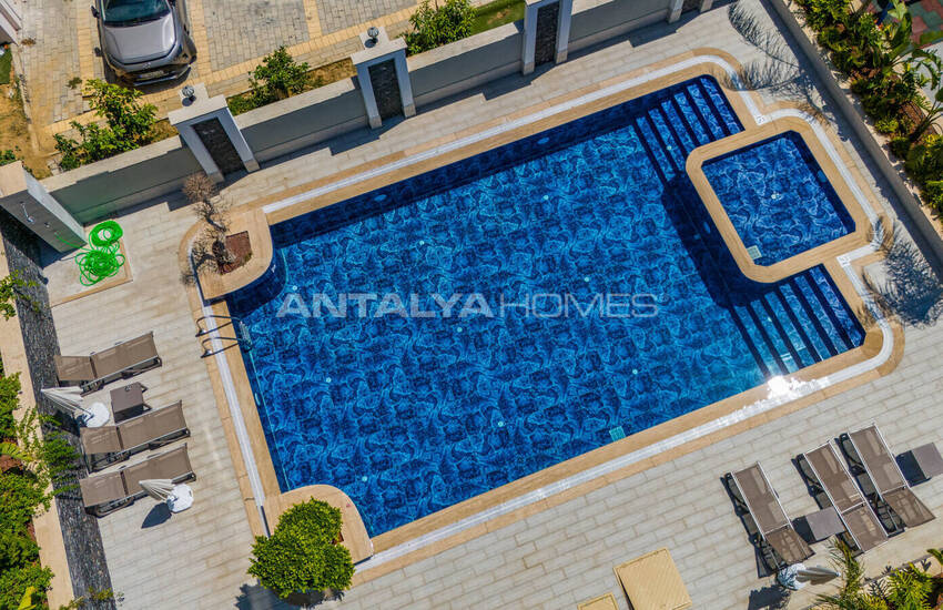 Стильные готовые квартиры в комплексе с бассейном в Алании 18