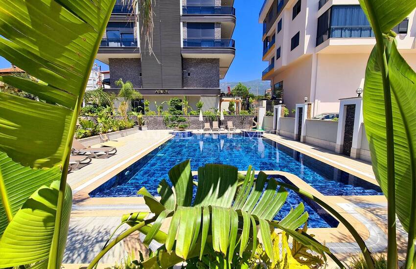 Стильные готовые квартиры в комплексе с бассейном в Алании 20