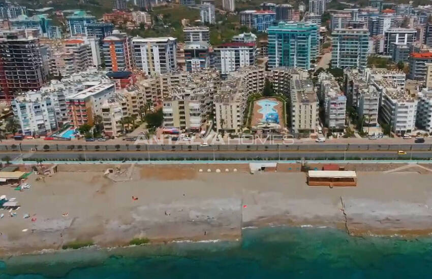 Недвижимость с видом на бассейн в комплексе на берегу моря в Махмутлар 6