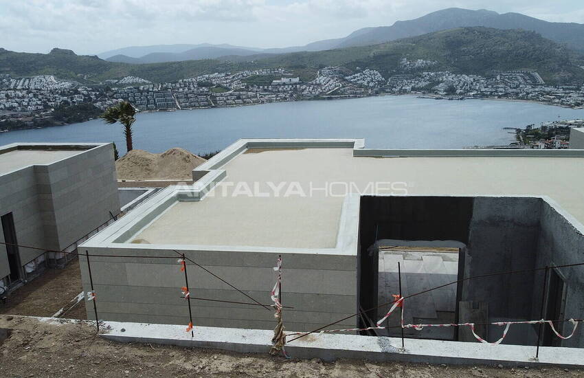 فيلات مطلة على الحمام سباحة والبحر في المدينة بودروم خليج جوندوغان 10