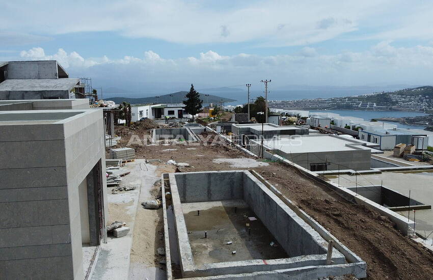 فيلات مطلة على الحمام سباحة والبحر في المدينة بودروم خليج جوندوغان 8