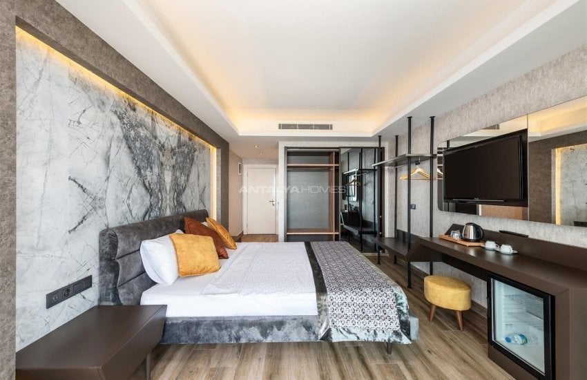 عقارات فاخرة للبيع بمفهوم فندق 5 نجوم في كوناكلي 33