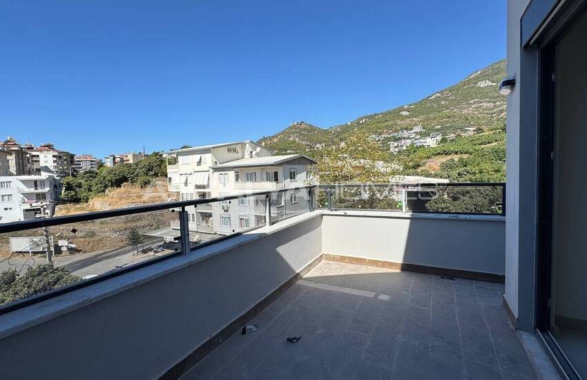 آپارتمان در یک مجتمع در نزدیکی امکانات رفاهی در آلانیا ترکیه 17