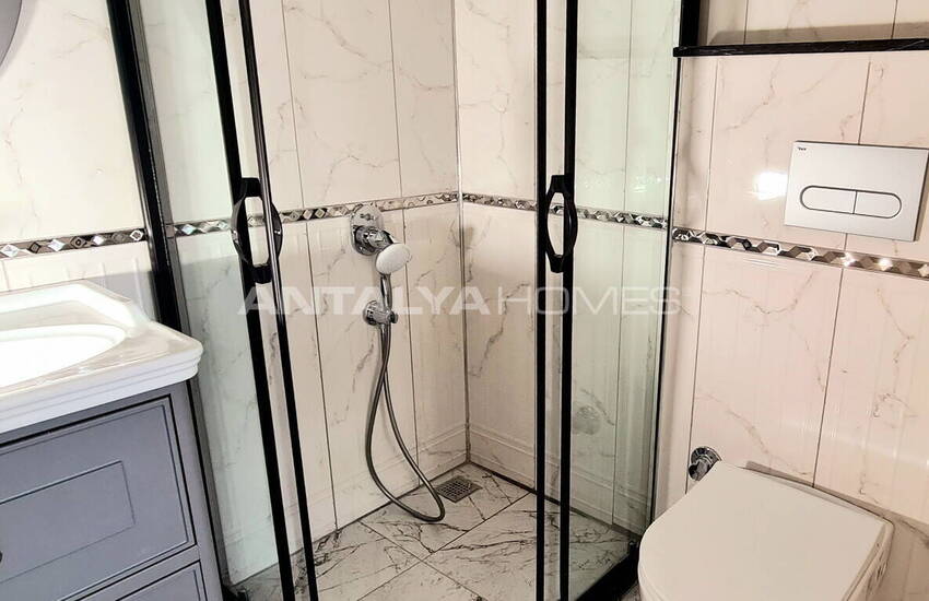 Стильные готовые квартиры в комплексе с бассейном в Алании 45