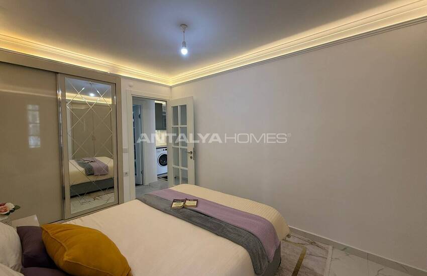 Недвижимость с видом на бассейн в комплексе на берегу моря в Махмутлар 10