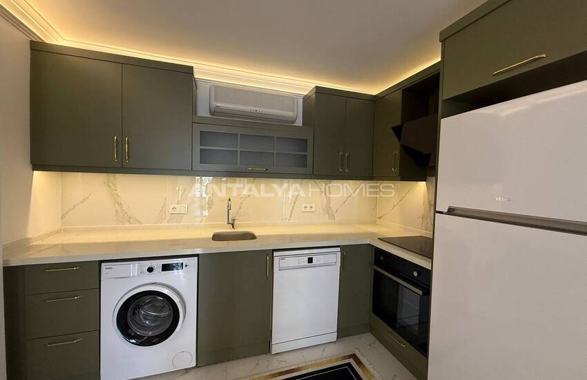 Недвижимость с видом на бассейн в комплексе на берегу моря в Махмутлар 9