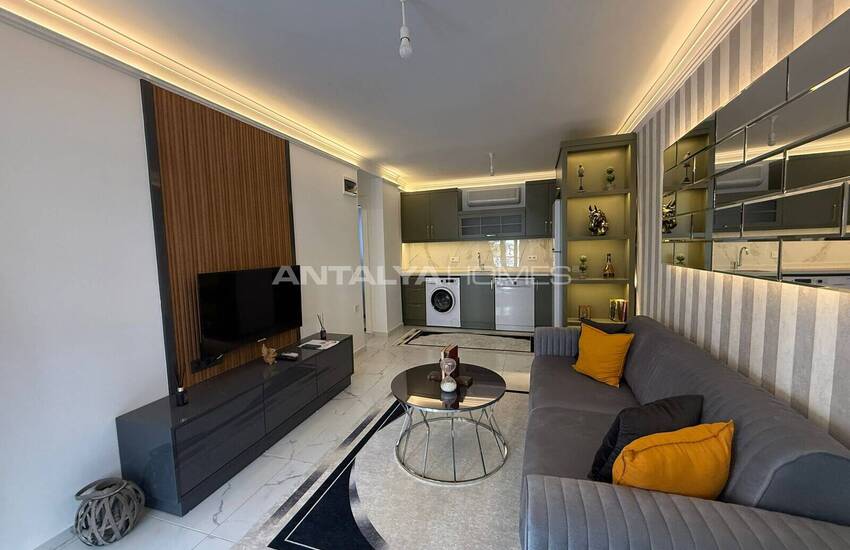 Недвижимость с видом на бассейн в комплексе на берегу моря в Махмутлар 7