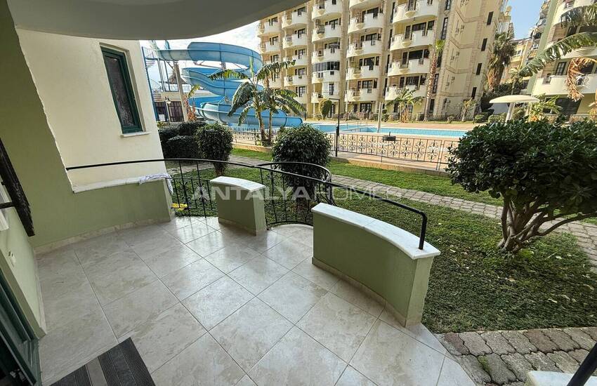 Недвижимость с видом на бассейн в комплексе на берегу моря в Махмутлар 14