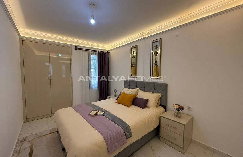 Недвижимость с видом на бассейн в комплексе на берегу моря в Махмутлар 11