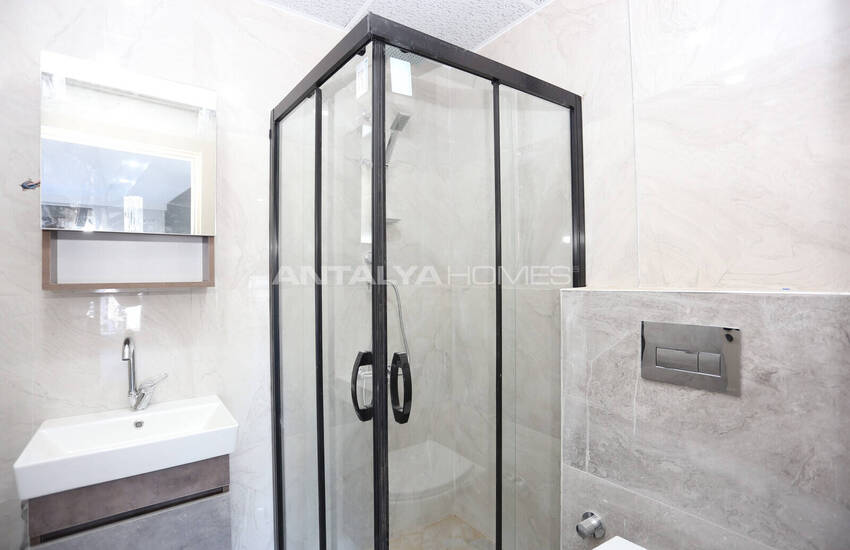 شقق في مجمع سكني يضم مسبحًا وموقف سيارات في أنطاليا 11