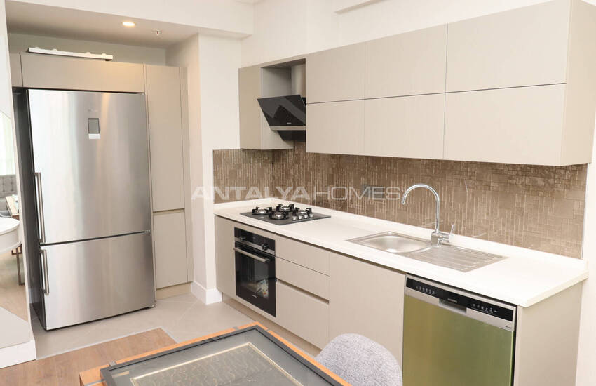 Недвижимость в комплексе с частным выходом на пляж в Анталии Кунду 16