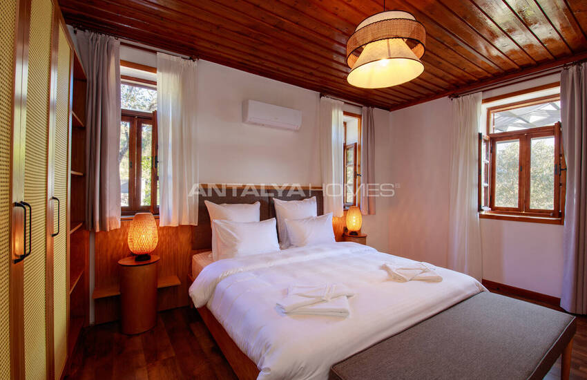 загородный дом на участке площадью 1 091 м² в Каякёй, Фетхие 34