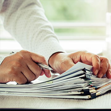 man investigating some documents man investigating some documents