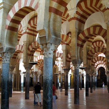 Córdoba’s architecture, a UNESCO city, famed for its Mezquita-Cathedral with red and white striped arches, an example of Islamic architecture Córdoba’s architecture, a UNESCO city, famed for its Mezquita-Cathedral with red and white striped arches, an example of Islamic architecture