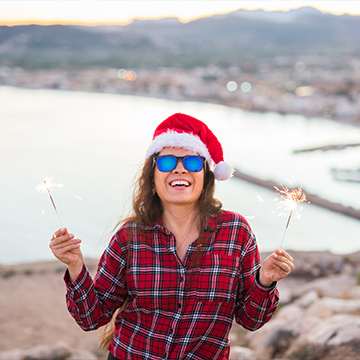 a woman holding sparklers