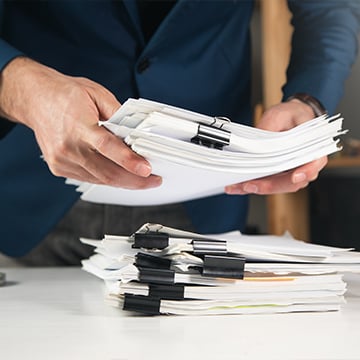 businessman holding documents in office businessman holding documents in office