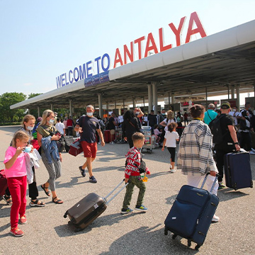 people walking front of the antalya airport