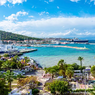 Scenic harbor in Çeşme, İzmir, Turkey, with turquoise Aegean waters and a vibrant waterfront—ideal for luxury summer homes and stylish coastal living. Scenic harbor in Çeşme, İzmir, Turkey, with turquoise Aegean waters and a vibrant waterfront—ideal for luxury summer homes and stylish coastal living.