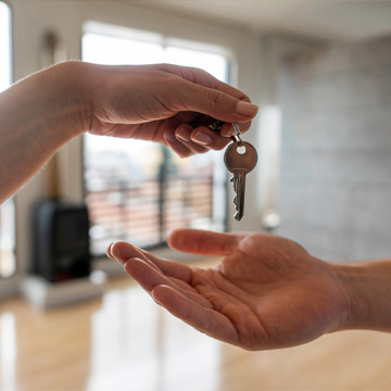 woman gives house keys to man woman gives house keys to man