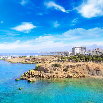a view of cyprus with sea and buildings a view of cyprus with sea and buildings