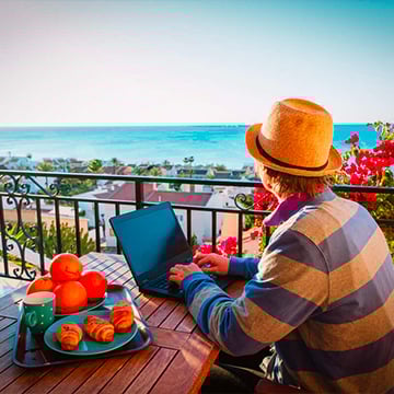 man admiring the view while working on computer man admiring the view while working on computer