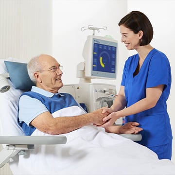 young nurse helping middle aged men in hospital young nurse helping middle aged men in hospital